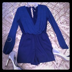 Blue romper w/ chiffon front & chiffon sleeves.
